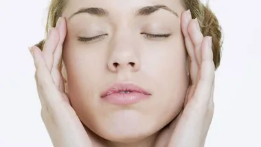 woman with head in her hands, stock image 