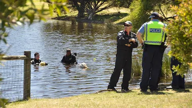 Police at the scene, where Sam Trott's body was found 