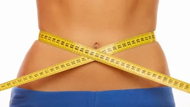 Woman's waist with measuring tape, diet, stock image