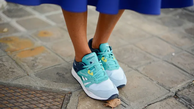 walking on you lunch break, woman wearing running shoes and skirt