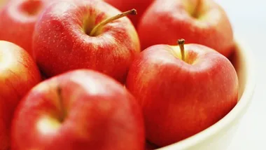 Bowl of red apples, close-up view; representing a healthy, natural food choice.