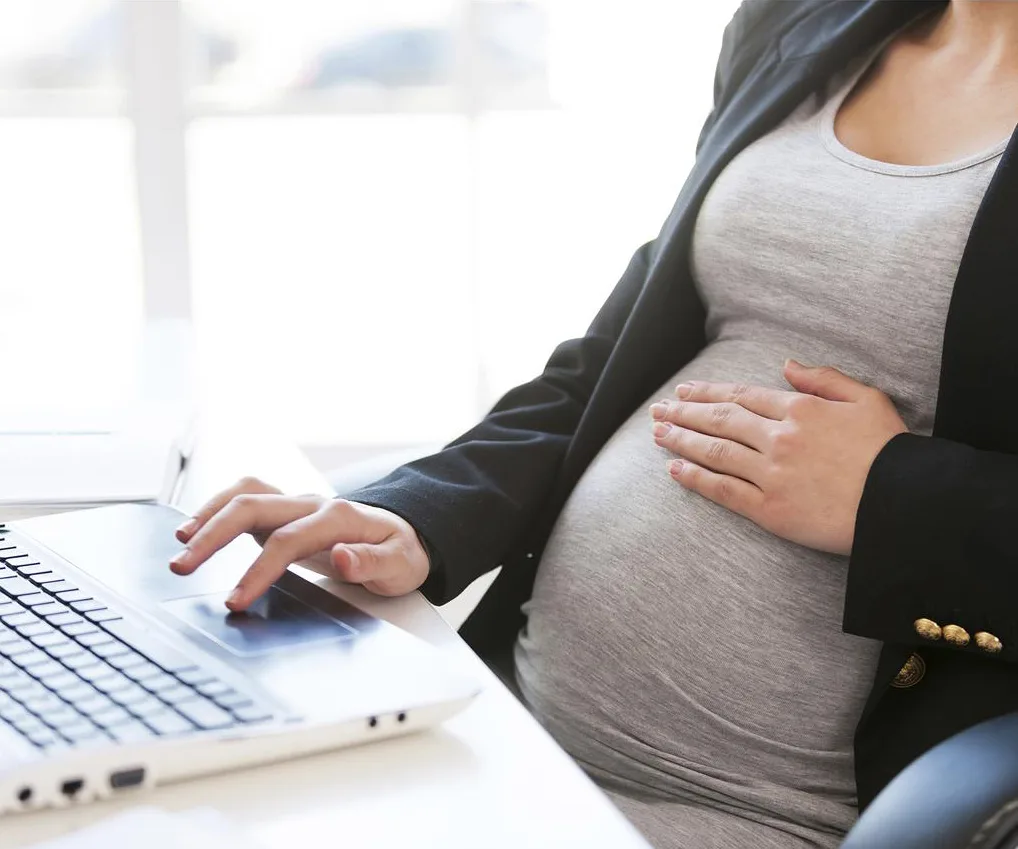 woman touching pregnant belly