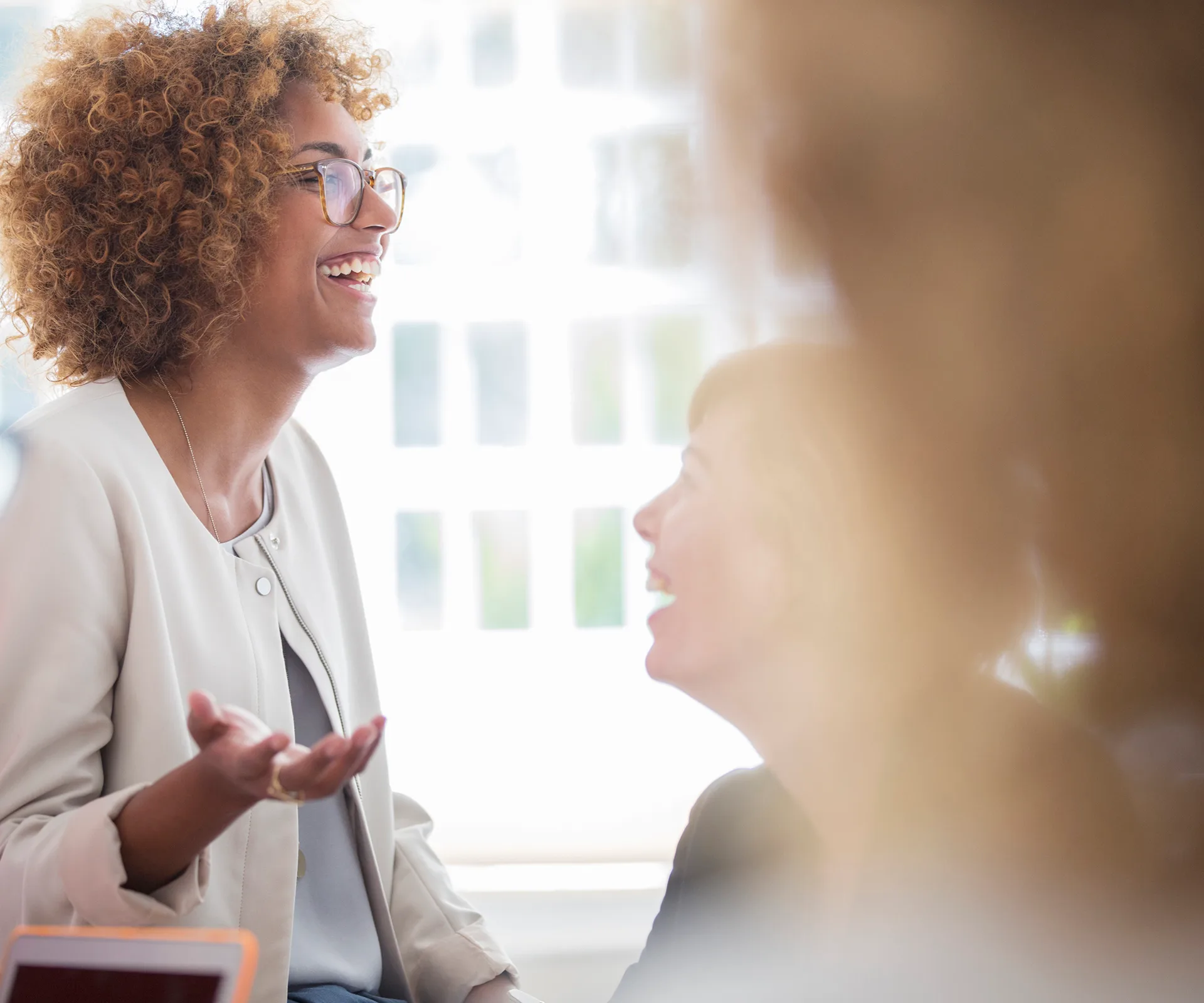 Business woman laughing in meeting