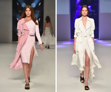 Models walking down the runway wearing pink and white dresses at a fashion show.
