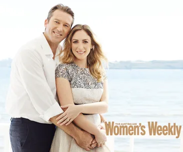 Couple embracing by the sea, featured in Australian Women's Weekly.