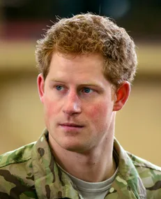 Young man in military uniform looking to the side.