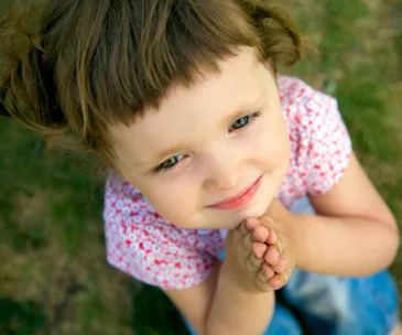 little girl praying Thinkstock 