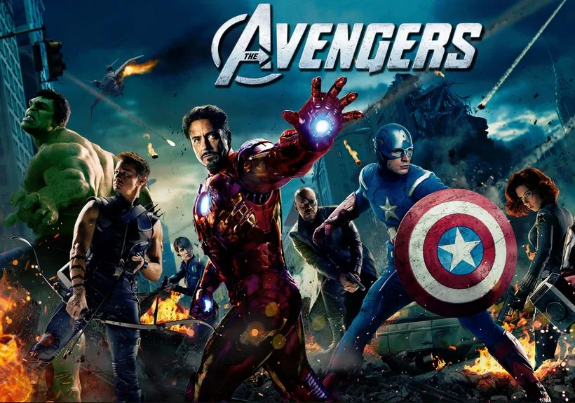 The Avengers superhero team stands in a battle-torn cityscape, featuring Iron Man, Captain America, Hulk, and others.