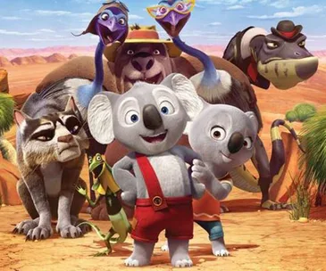Characters from "Blinky Bill: The Movie" stand together in a desert landscape, featuring Blinky Bill, a koala, at the center.