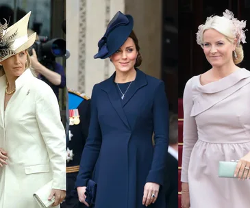 Three women in elegant outfits and hats at a formal event; one in white, one in navy, and one in pale pink.