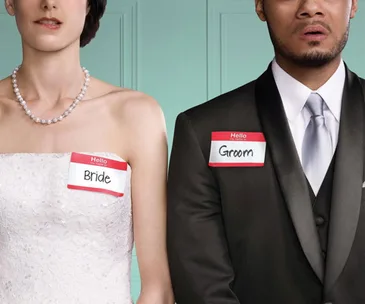 Bride and groom in wedding attire with name tags reading "Bride" and "Groom," from "Married at First Sight" show.