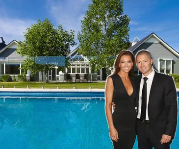 Luxury mansion with pool and two people smiling in formal wear in the foreground.