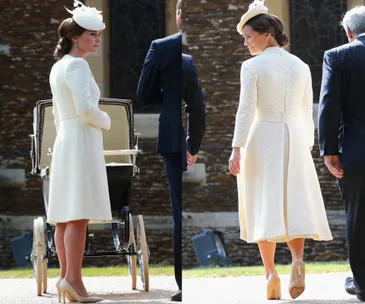 Two women in similar cream dresses and hats, one by a pram, outside a stone building.