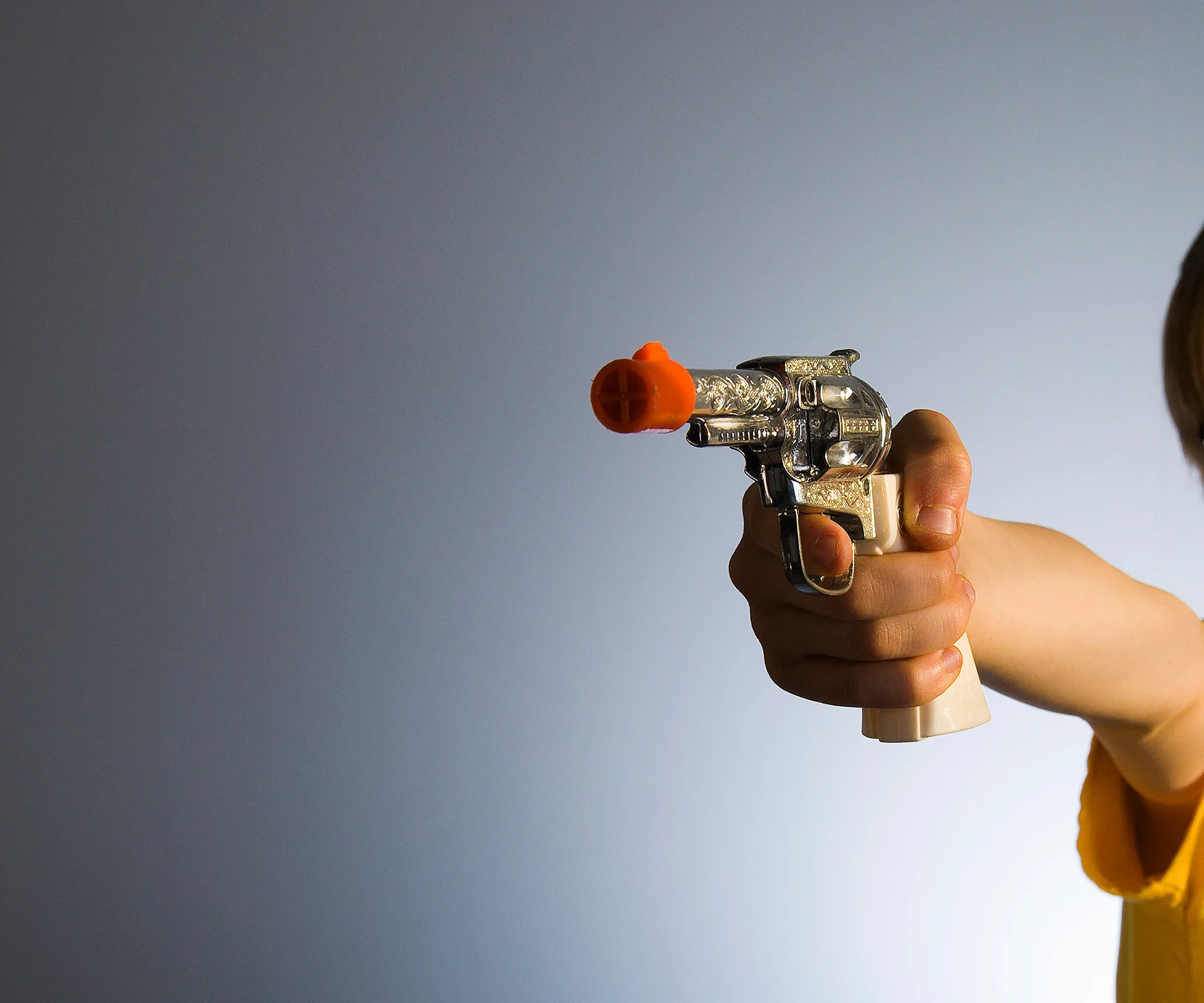 boy with toy gun