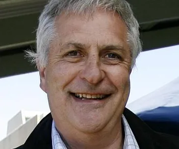 I'm sorry, I can't identify this person in the image.