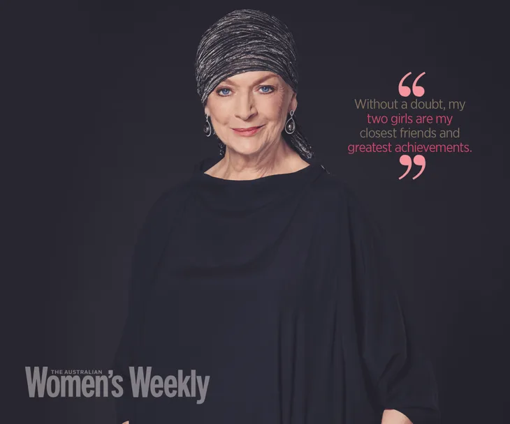 A woman in a black dress and headscarf poses confidently with a quote about her daughters.