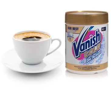 Cup of coffee next to a container of Vanish Gold stain remover.