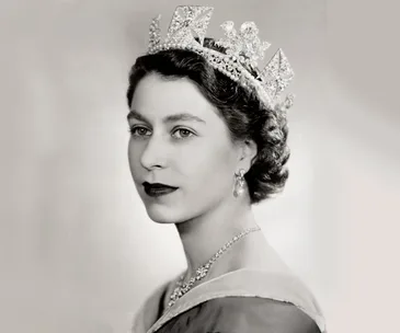Portrait of a young woman in a tiara and formal attire, looking poised and elegant.