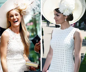 Women in elegant white dresses and large hats at a racing event.
