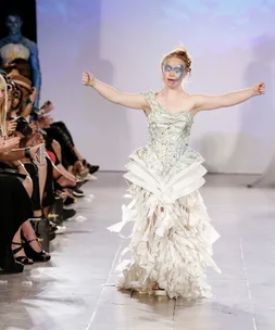 Model with Down syndrome in a unique white dress walking the runway at New York Fashion Week.