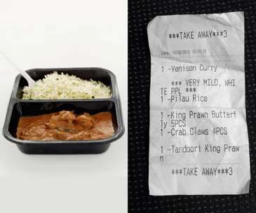 "Image shows a meal of curry with rice in a container, and a receipt noting 'very mild, white ppl.'"