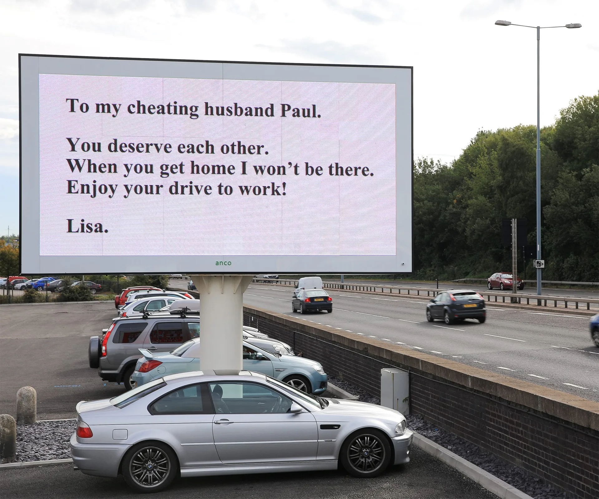 Billboard message reads: "To my cheating husband Paul. You deserve each other. I won't be there. Enjoy your drive! Lisa."