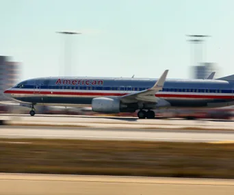 American Airlines plane taking off from a runway.