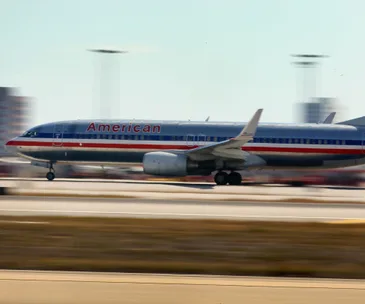 American Airlines plane taking off from a runway.
