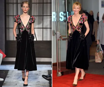 Model and person in floral-embroidered black dress, runway left, event entrance right.