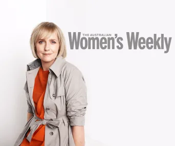 Female in gray coat over orange top, sitting against a white background, "The Australian Women's Weekly" text behind.