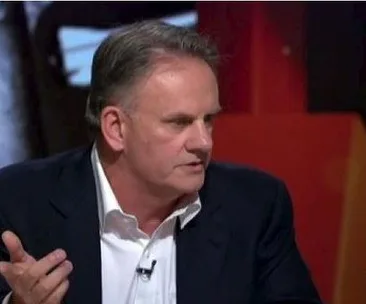 Mark Latham gesturing while speaking during a televised discussion.