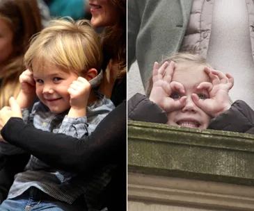 Children making funny faces, one with hands on face, the other mimicking goggles.