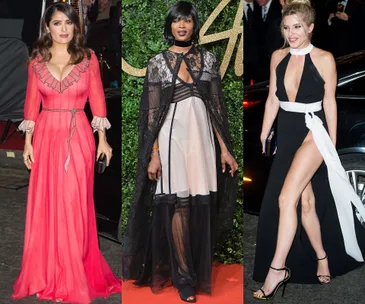 Three women in evening gowns on a red carpet, each with unique fashion styles.