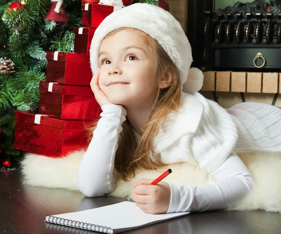 Little girl writing to Santa