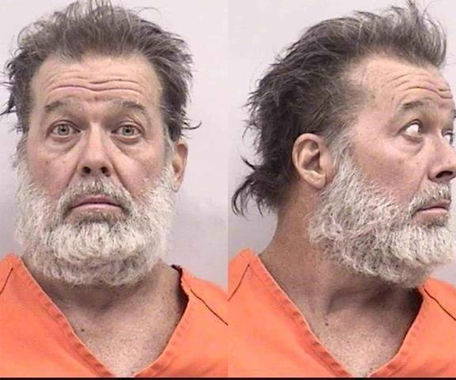 Mugshot of a man with a beard in an orange jumpsuit, facing forward and in profile.