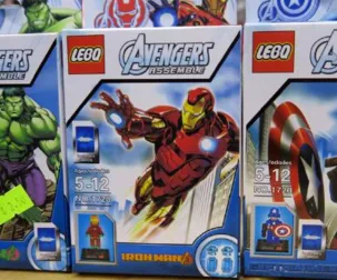 LEGO knockoff sets featuring Avengers characters like Iron Man, Captain America, and others on display in toy packaging.