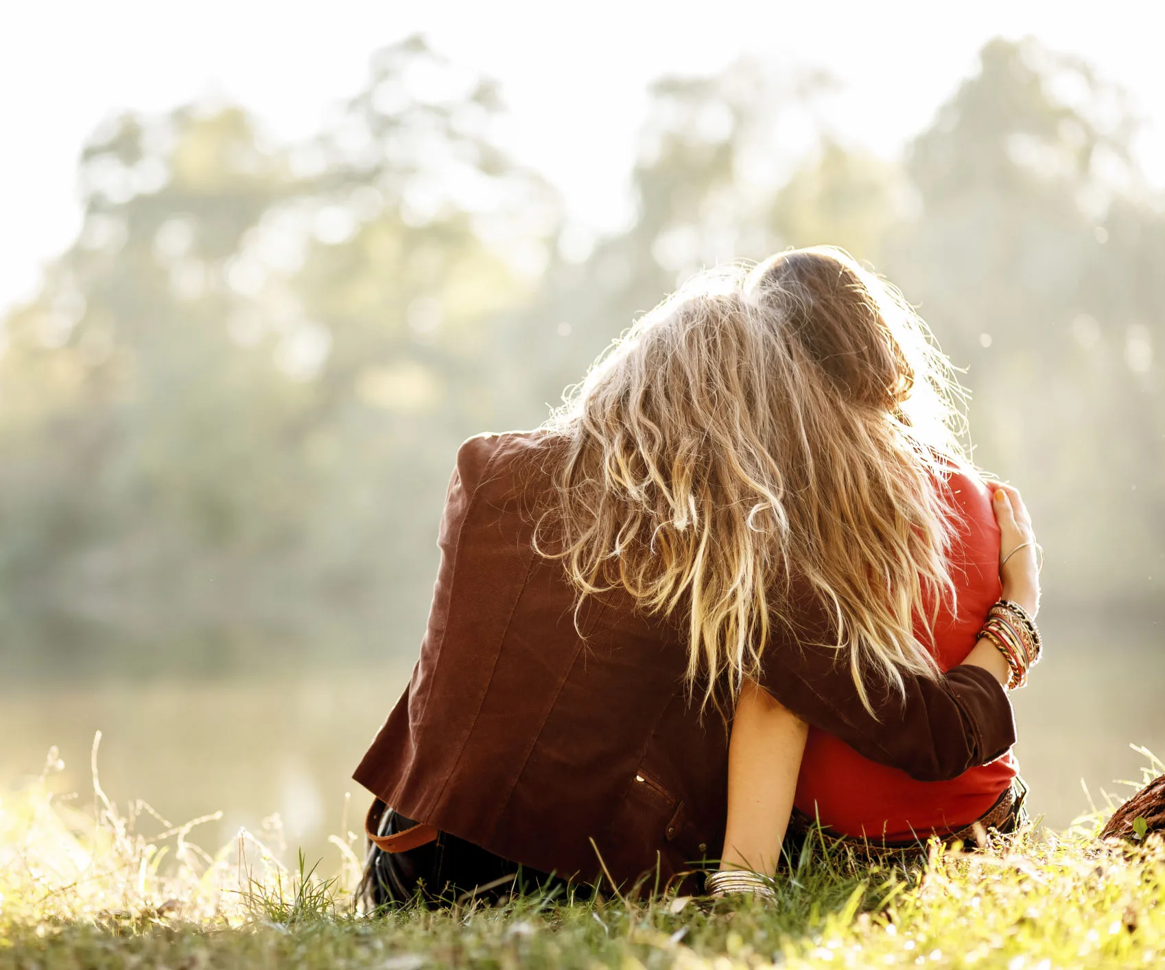 Lady comforting a girl