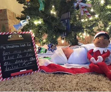 baby under Christmas tree
