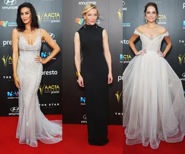 Women in elegant dresses pose on the AACTA Awards red carpet backdrop.
