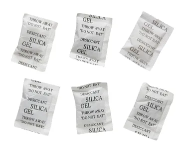 Silica gel packets with "Do Not Eat" warning labels.