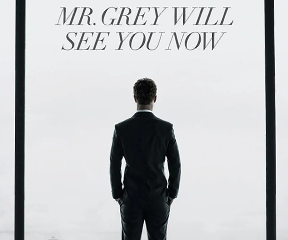 Rear view of a man in a suit facing large windows, with text "MR. GREY WILL SEE YOU NOW" at the top.