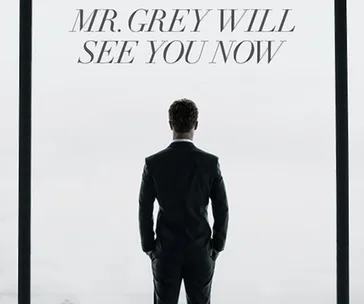 Rear view of a man in a suit facing large windows, with text "MR. GREY WILL SEE YOU NOW" at the top.