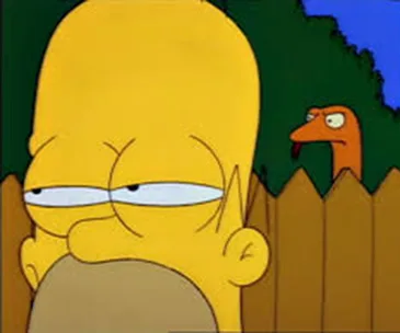 Homer Simpson squinting suspiciously over a fence; a snake is peeking from behind him.