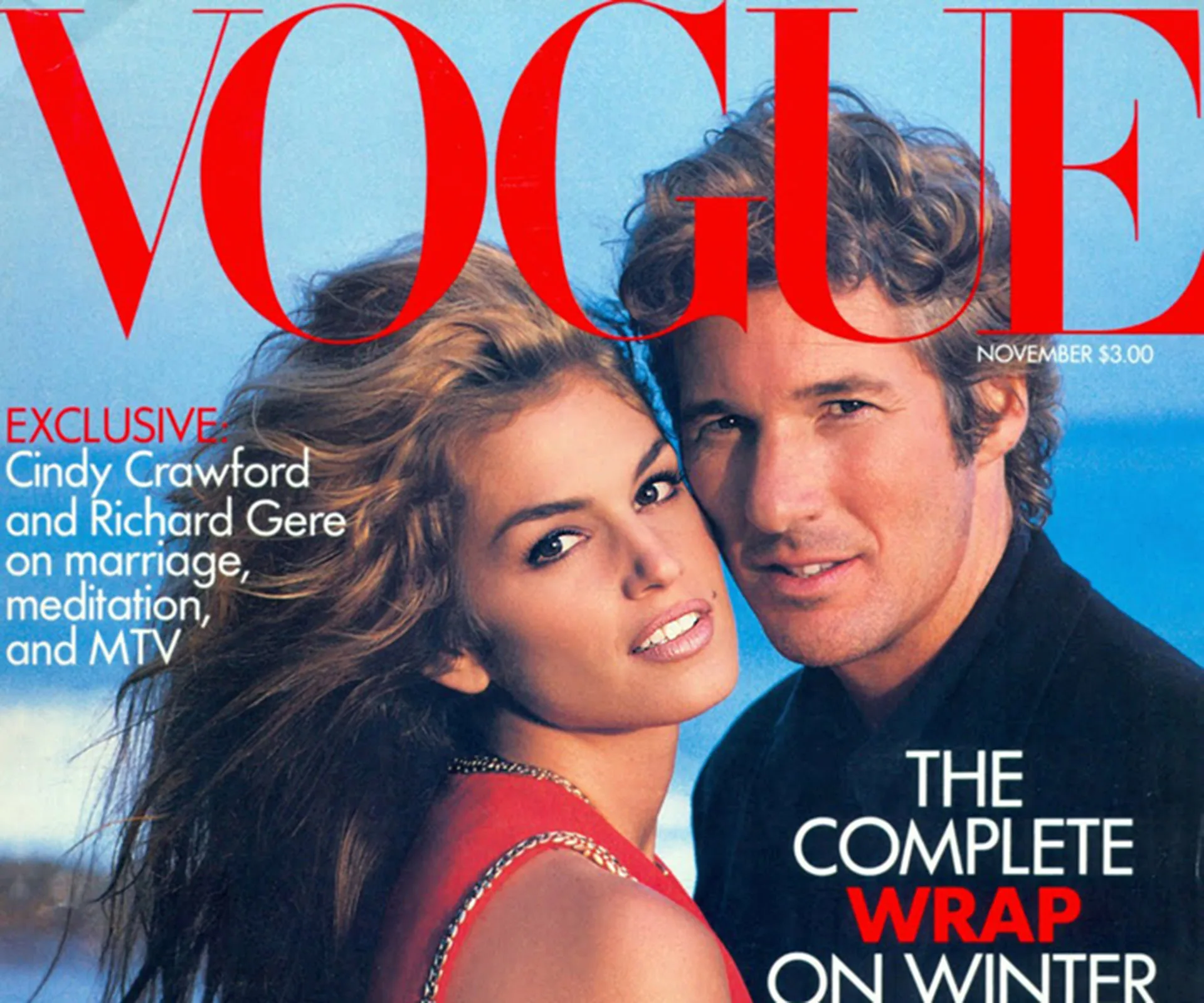Cindy Crawford and Richard Gere on Vogue November cover, 1992, posing closely, blue sky background.