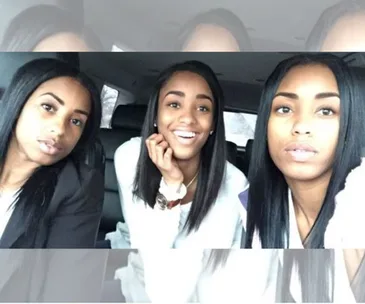 Three women with similar features smiling in a car, known as the viral mom, twin, and me photo by Kaylan Mahomes.