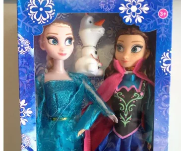 Boxed Elsa, Anna, and Olaf dolls from Disney's Frozen with floral design on packaging.
