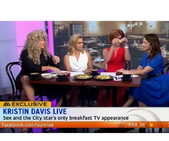 Four women sitting at a table during a TV segment about Kristin Davis's only breakfast TV appearance.