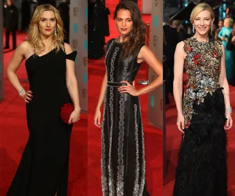 Red carpet at 2016 BAFTA Awards with three women in elegant evening gowns.