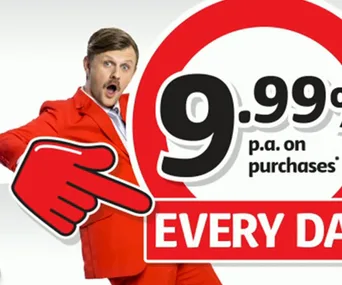 Red-suited man points to "9.99% on purchases" text, wearing a surprised expression, promoting a sale.