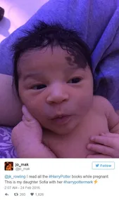 Baby with lightning-shaped birthmark on forehead, resembling Harry Potter's scar, lying against a person.